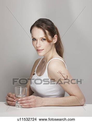 Portrait of Women with Anchor Tatoo View Large Photo Image Picture - Portrait of Women with Anchor Tatoo. Fotosearch