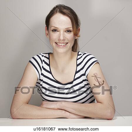 Portrait of Women with Anchor Tatoo View Large Photo Image Stock Photo - Portrait of Women with Anchor Tatoo. Fotosearch