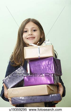 Stock Photography - portrait of young girl with presents. Fotosearch