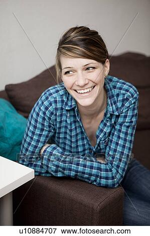 Stock Photo - Portrait of young woman, laughing. Fotosearch