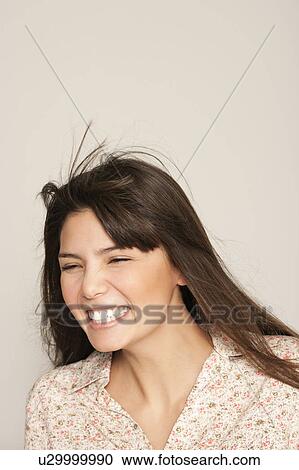 Portrait of young woman laughting View Large Photo Image Stock Image - Portrait of young woman laughting. Fotosearch