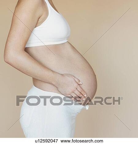 Pregnancy bump, profile View Large Photo Image Stock Photo - Pregnancy bump, profile. Fotosearch