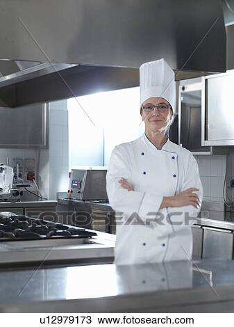Proud Head Chef standing in his Restaurant View Large Photo Image Stock Image - Proud Head Chef standing in his Restaurant. Fotosearch