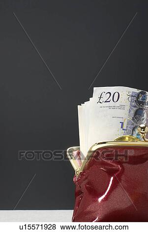 Purse with pound notes in it View Large Photo Image Stock Photo - Purse with pound notes in it. Fotosearch