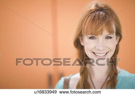 Red haired woman smiling View Large Photo Image Stock Photo - Red haired woman smiling. Fotosearch