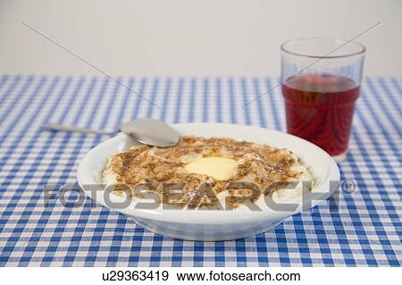 Stock Photo - Rice porridge with cinnamon and sugar. Fotosearch