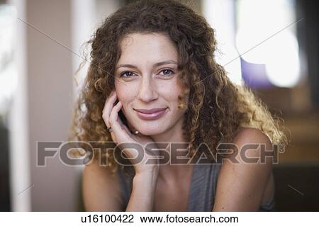 Stock Image - romantic Portrait of a Woman smiling. Fotosearch