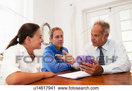 Salesman in discussion with couple View Large Photo Image Stock Image - Salesman in discussion with couple. Fotosearch