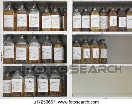 Stock Photo - Sample bottles on shelves. Fotosearch