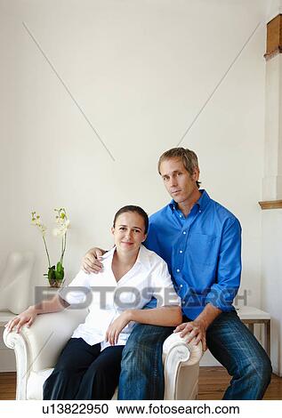Stock Image -  Satisfied couple at home. Fotosearch