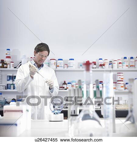 Scientist performing test in lab View Large Photo Image Stock Photography - Scientist performing test in lab. Fotosearch