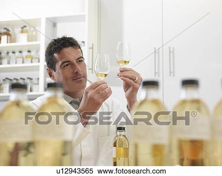 Scientist tasting whisky in plant View Large Photo Image Stock Photography - Scientist tasting whisky in plant. Fotosearch