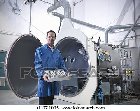 Scientist with product and vacuum tank View Large Photo Image Stock Photography - Scientist with product and vacuum tank. Fotosearch
