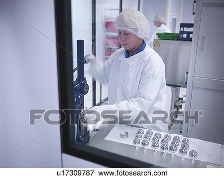 Scientist with product in clean room View Large Photo Image Stock Photo - Scientist with product in clean room. Fotosearch