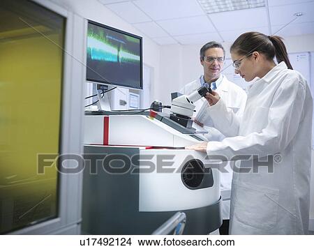 Scientists at laser welding machine View Large Photo Image Picture - Scientists at laser welding machine. Fotosearch