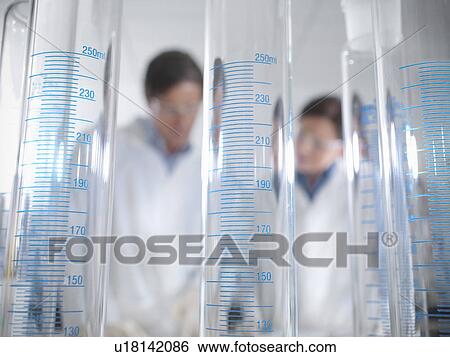 Scientists behind laboratory equipment View Large Photo Image Stock Photograph - Scientists behind laboratory equipment. Fotosearch