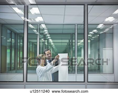 Scientists discuss plans in office View Large Photo Image Stock Image - Scientists discuss plans in office. Fotosearch