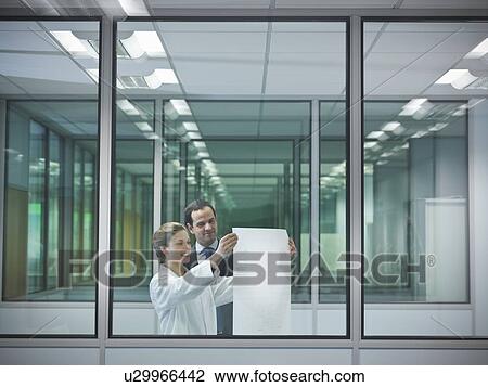 Scientists discuss plans in office View Large Photo Image Stock Image - Scientists discuss plans in office. Fotosearch