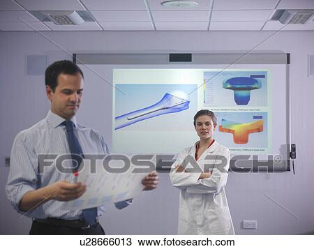 Scientists in front of product designs View Large Photo Image Stock Image - Scientists in front of product designs. Fotosearch