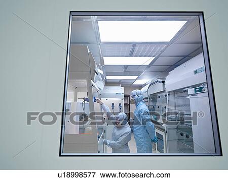 Stock Photo - Scientists in laboratory clean room. Fotosearch