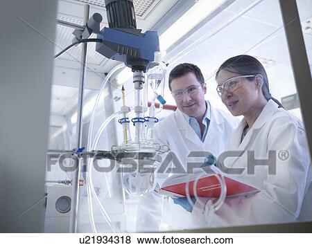 Scientists with experiment in laboratory View Large Photo Image Stock Photo - Scientists with experiment in laboratory. Fotosearch