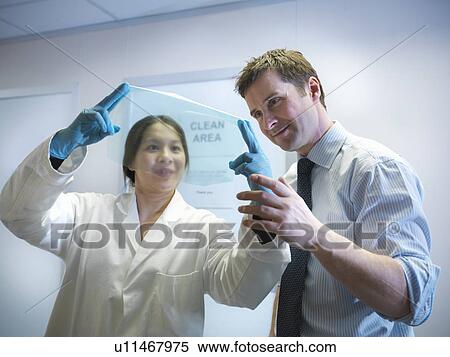 Scientists with finished product View Large Photo Image Stock Photography - Scientists with finished product. Fotosearch