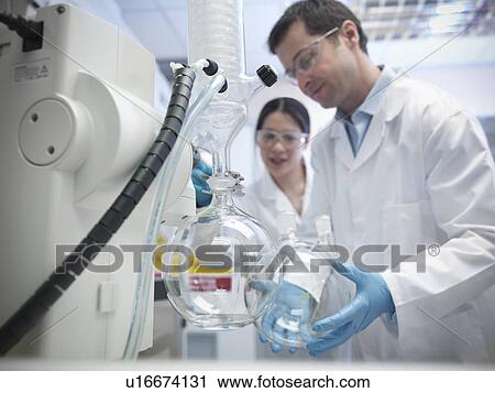 Scientists working with vacuum still View Large Photo Image Stock Image - Scientists working with vacuum still. Fotosearch