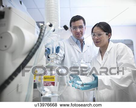 Scientists working with vacuum still View Large Photo Image Stock Photo - Scientists working with vacuum still. Fotosearch