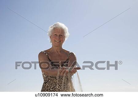 Senior Woman on the beach View Large Photo Image Picture - Senior Woman on the beach. Fotosearch