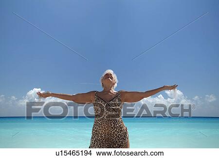 Picture - Senior Woman on the beach. Fotosearch