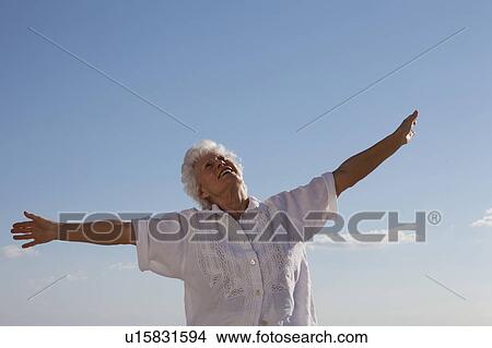 Picture - Senior Woman on the beach. Fotosearch