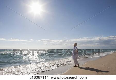 Senior Woman on the beach View Large Photo Image Picture - Senior Woman on the beach. Fotosearch