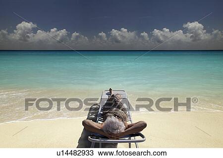 Senior Woman on the beach View Large Photo Image Stock Image - Senior Woman on the beach. Fotosearch