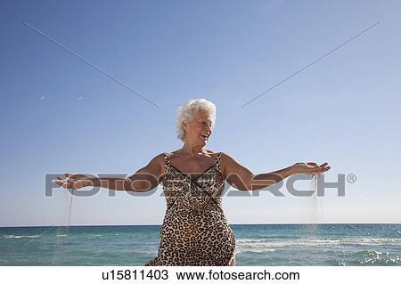 Senior Woman on the beach View Large Photo Image Stock Image - Senior Woman on the beach. Fotosearch