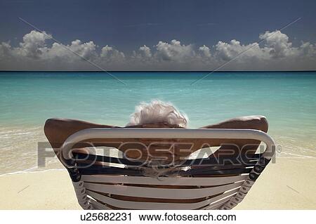Senior Woman on the beach View Large Photo Image Stock Image - Senior Woman on the beach. Fotosearch