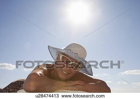 Stock Image - Senior Woman on the beach. Fotosearch