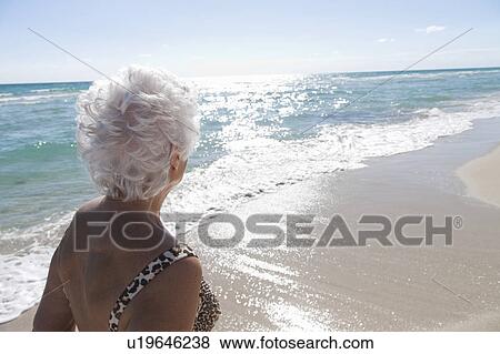 Senior Woman on the beach View Large Photo Image Stock Photo - Senior Woman on the beach. Fotosearch