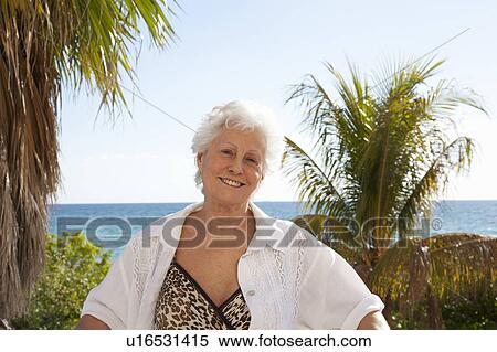 Senior Woman on the beach View Large Photo Image Stock Photography - Senior Woman on the beach. Fotosearch