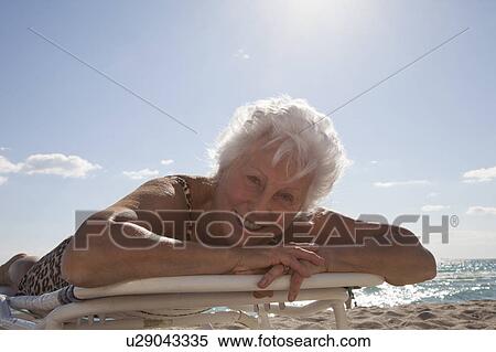 Senior Woman on the beach View Large Photo Image Stock Photography - Senior Woman on the beach. Fotosearch