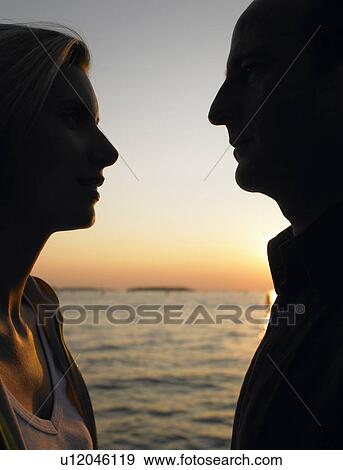 Silhouette of a couple View Large Photo Image Stock Photo - Silhouette of a couple. Fotosearch