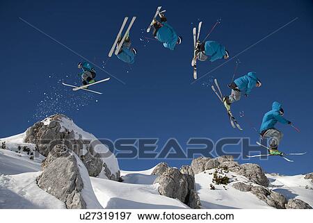 Skier doing dangerous free ride jump View Large Photo Image Stock Photo - Skier doing dangerous free ride jump. Fotosearch