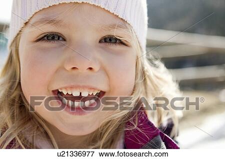 Smiling girl standing outdoors View Large Photo Image Stock Photo - Smiling girl standing outdoors. Fotosearch