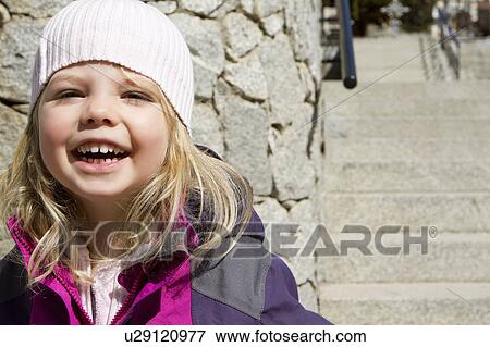 Smiling girl standing outdoors View Large Photo Image Stock Photo - Smiling girl standing outdoors. Fotosearch