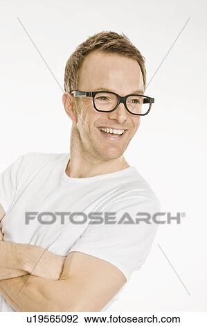Smiling man wearing eyeglasses View Large Photo Image Stock Image - Smiling man wearing eyeglasses. Fotosearch