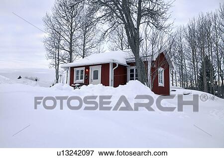 Snowed in red cottage View Large Photo Image Stock Photo - Snowed in red cottage. Fotosearch