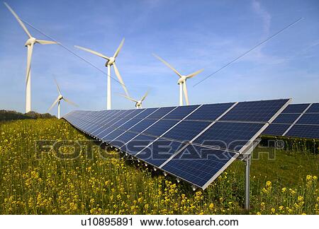 Solar panels and wind turbines in field View Large Photo Image Stock Image - Solar panels and wind turbines in field. Fotosearch