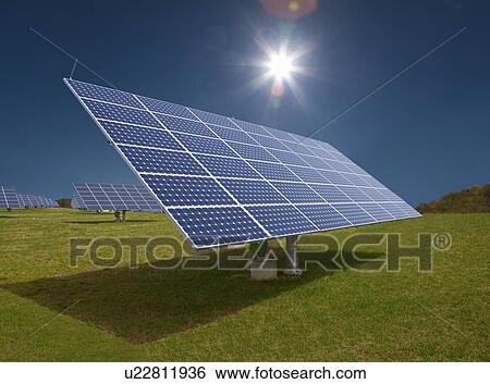 Stock Photograph - Solar panels in field. Fotosearch