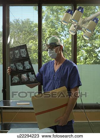 Surgeon with x-ray View Large Photo Image Stock Image - Surgeon with x-ray. Fotosearch