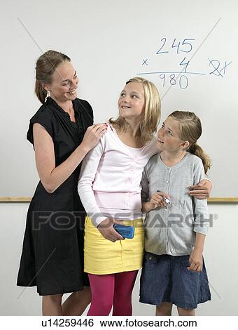 Teacher and students in classroom View Large Photo Image Stock Photograph - Teacher and students in classroom. Fotosearch