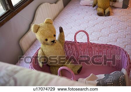 Stock Photo - Teddy on a bed. Fotosearch